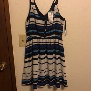 Spaghetti strap, stripped dress. Never worn.